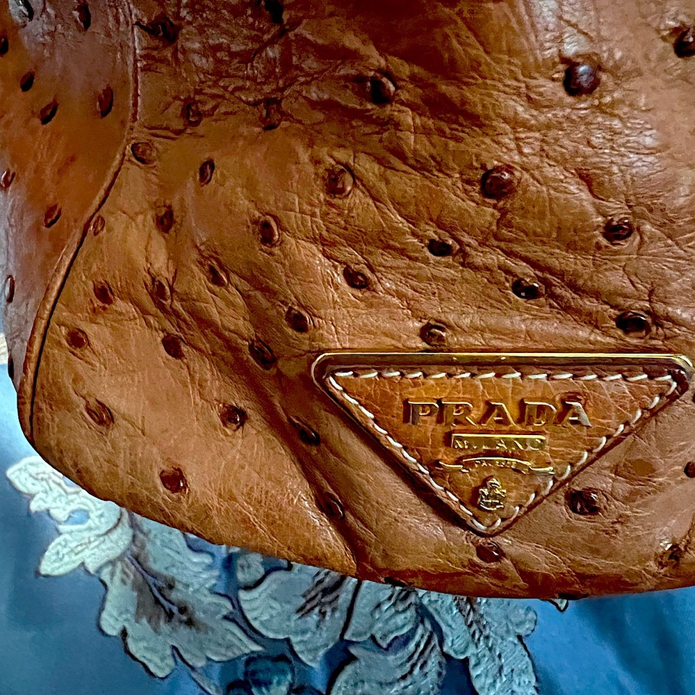 Prada Milano ostrich leather bag. Tan color with a stain on the bottom.